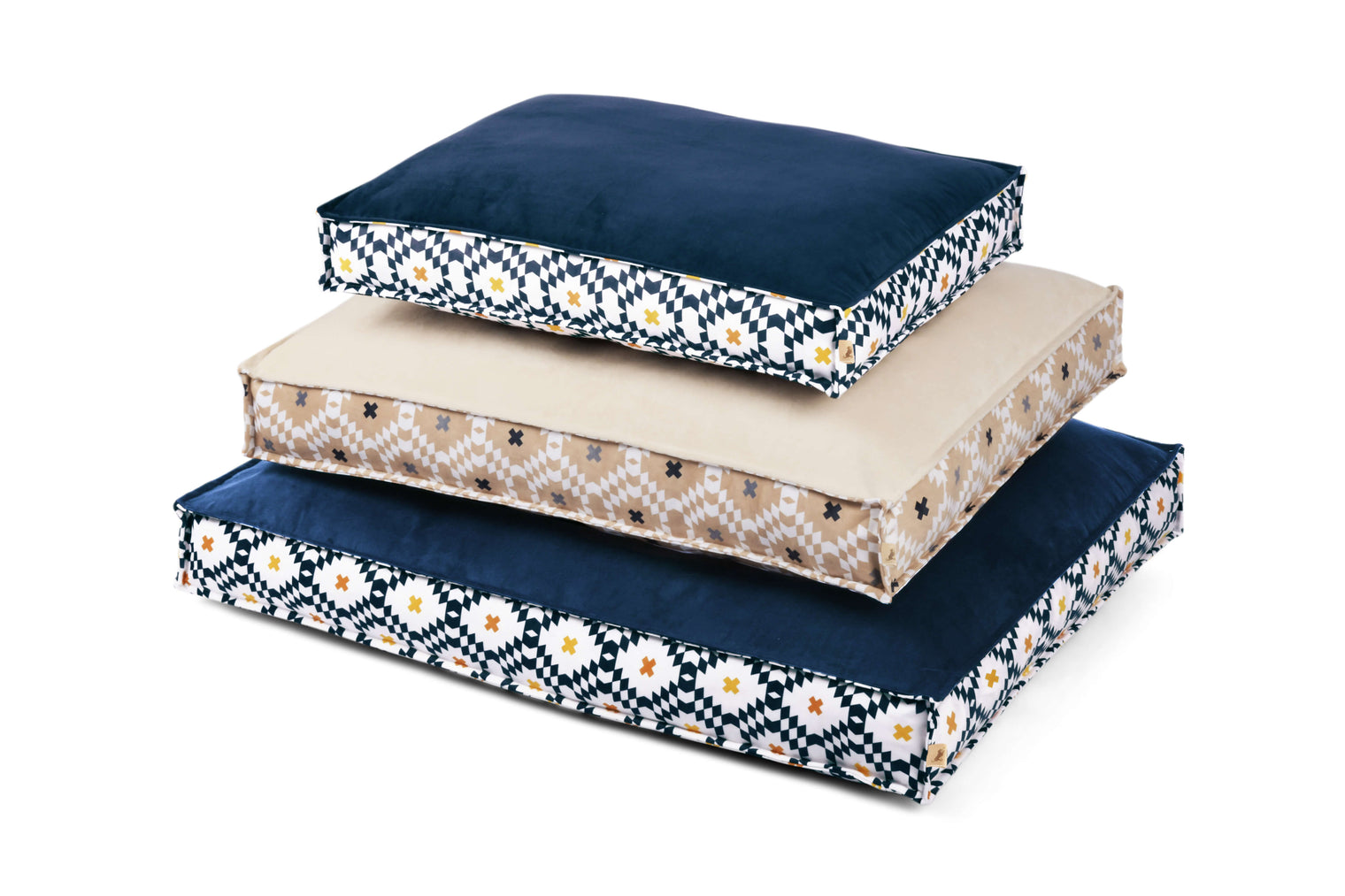 Three sizes of rectangle P.L.A.Y. Marina Boxy Bed with a striped design and reversible cover stacked together.