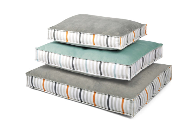 Three stacked P.L.A.Y. Seaside Boxy Beds with contemporary striped design and reversible cover for dogs. Striped dog bed in different sizes.