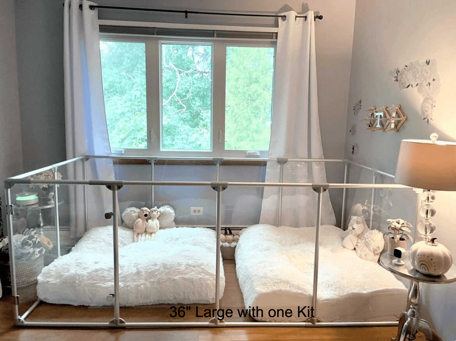 A large Lucidium Pen with one Universal Add-On Kit to make it very large, with two fluffy white dog beds.