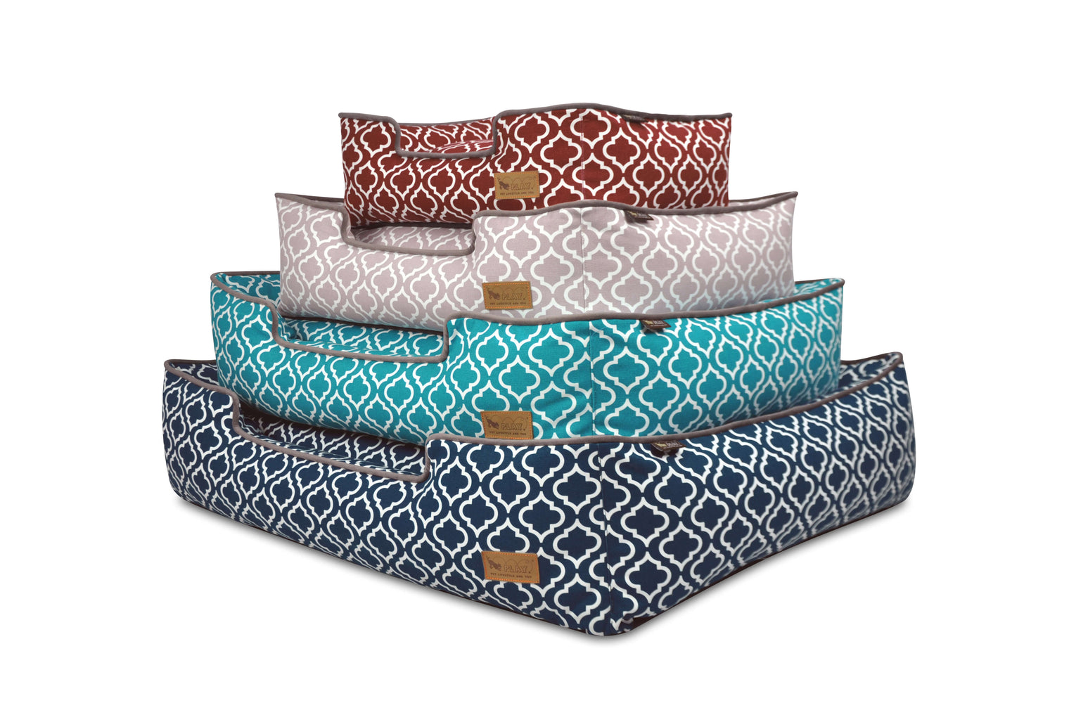 Stack of P.L.A.Y. Moroccan Lounge Beds in various vibrant colors and intricate patterns