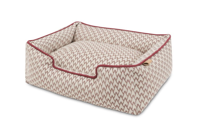 P.L.A.Y. Vineyard Lounge bolster style dog bed with elevated sides in a wine-inspired pattern, providing comfort for pets.