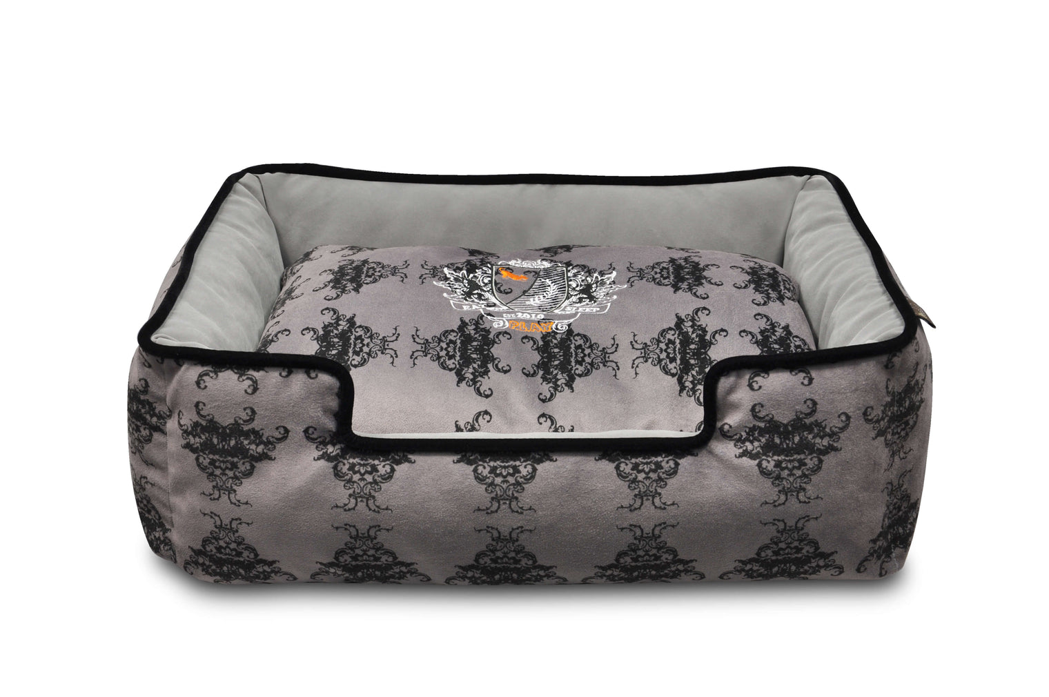 P.L.A.Y. Royal Crest Lounge Bed with Victorian-style royal crest print and plush black suede.