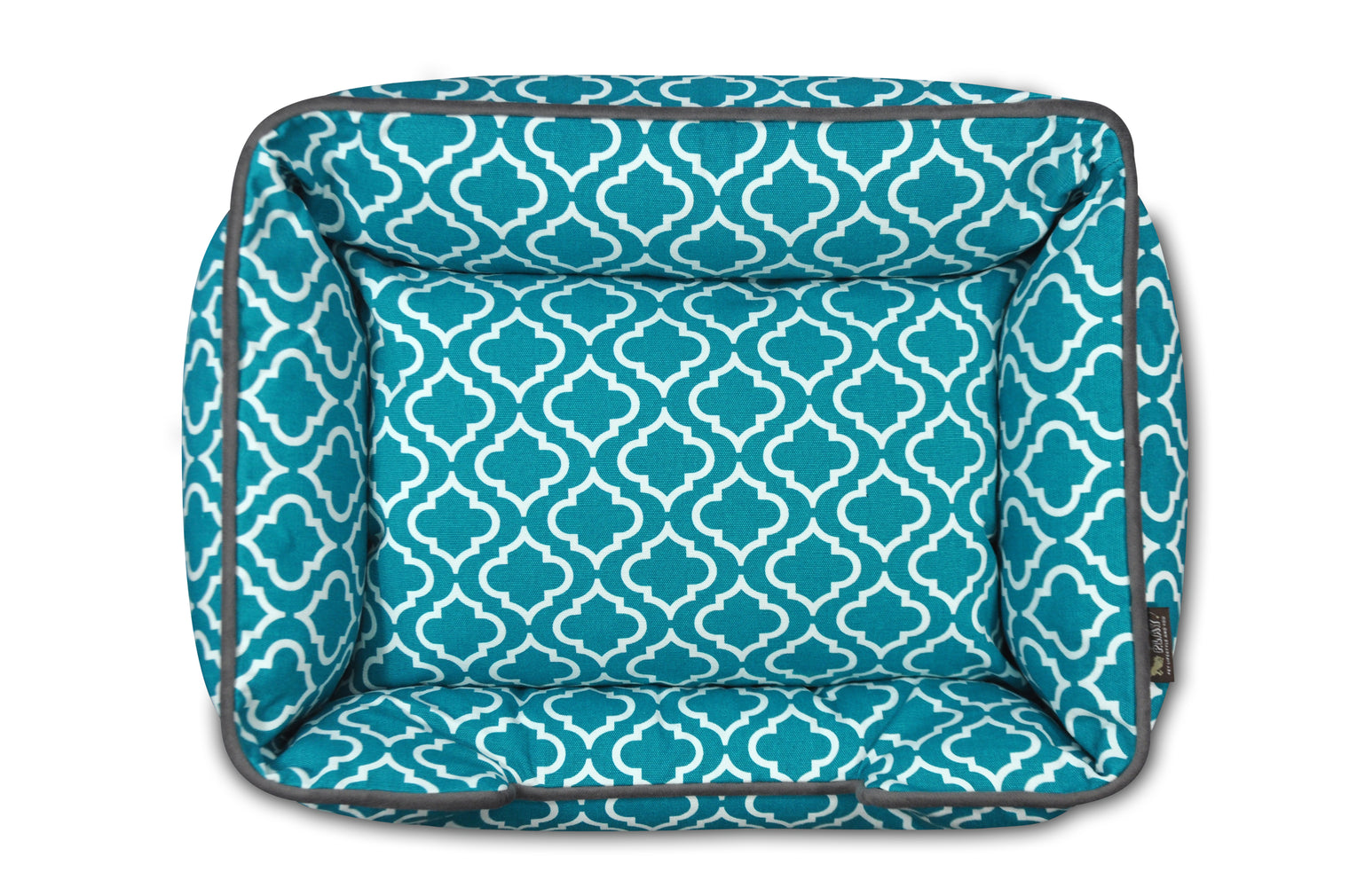 P.L.A.Y. Moroccan Lounge Bed in teal with intricate patterns, providing a comfortable and stylish resting place for your dog.