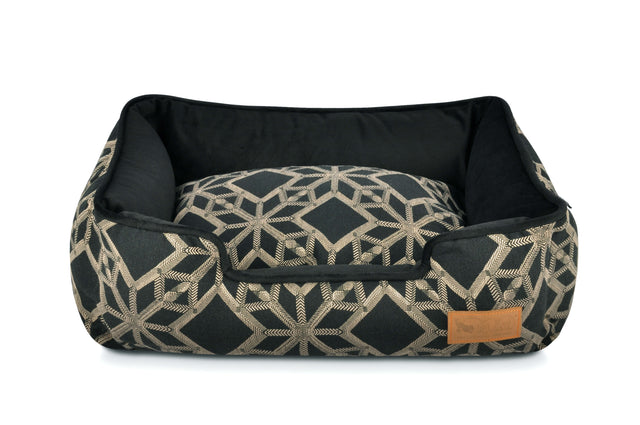 P.L.A.Y. Solstice Lounge Bed with geometric patterns in black and gray, featuring high supportive sides for pets' comfort and modern flair