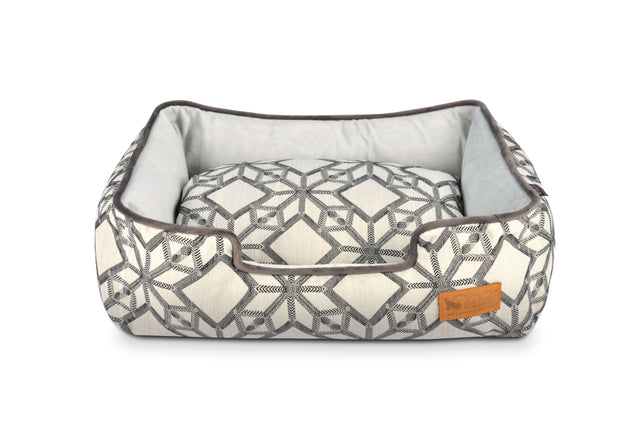 P.L.A.Y. Solstice Lounge Bed with geometric pattern in white and gray, high supportive sides, perfect for pets' sunbathing and relaxation
