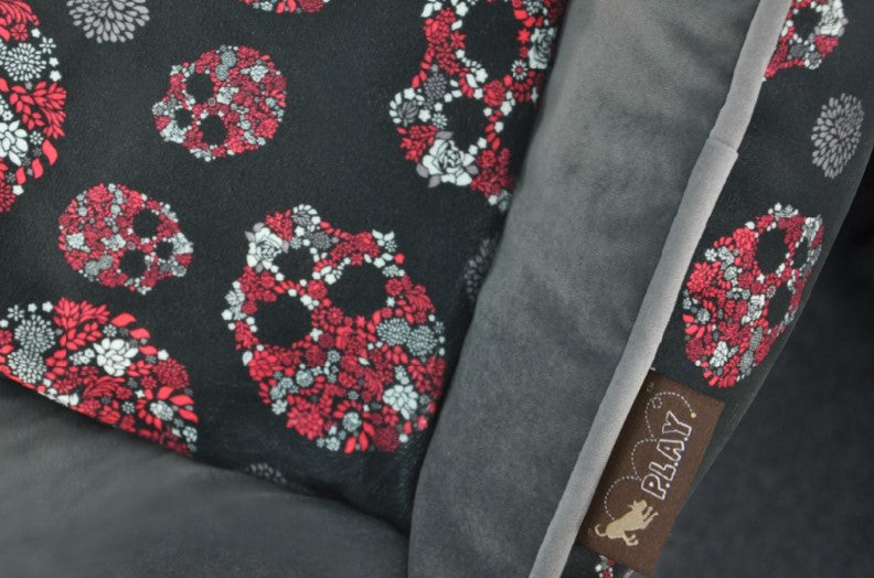 P.L.A.Y. Skulls & Roses Lounge Bed with skull motif and floral design showing brand tag.