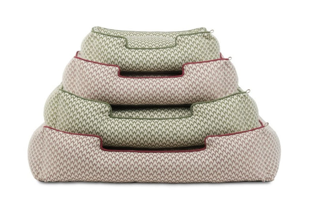 Stack of P.L.A.Y. Vineyard Lounge Beds in cabernet red and olive green, showcasing bolster style dog bed design with elevated sides.