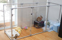  36 inch height medium dog pen in silver color in rectangular shape with rabbit