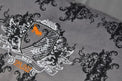 Royal Crest Victorian-style print on P.L.A.Y. Royal Crest Lounge Bed with plush black suede and intricate design for luxury pampering