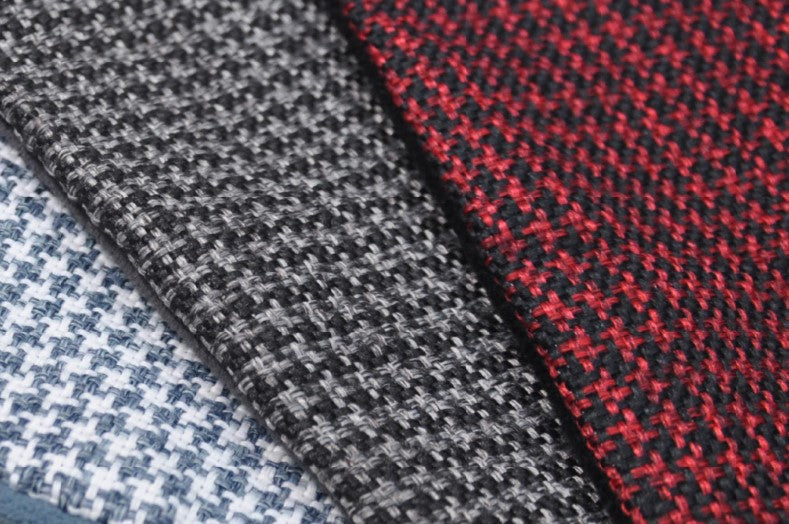 Three chic houndstooth fabric options in white, black, and red for P.L.A.Y. Houndstooth Lounge Beds, offering a sophisticated touch for your pup's resting space.