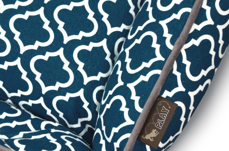 P.L.A.Y. Moroccan Lounge Bed featuring intricate blue and white Moroccan pattern with a soft grey border