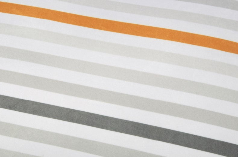 Close-up of the contemporary striped design on the Seaside Boxy Bed's reversible cover