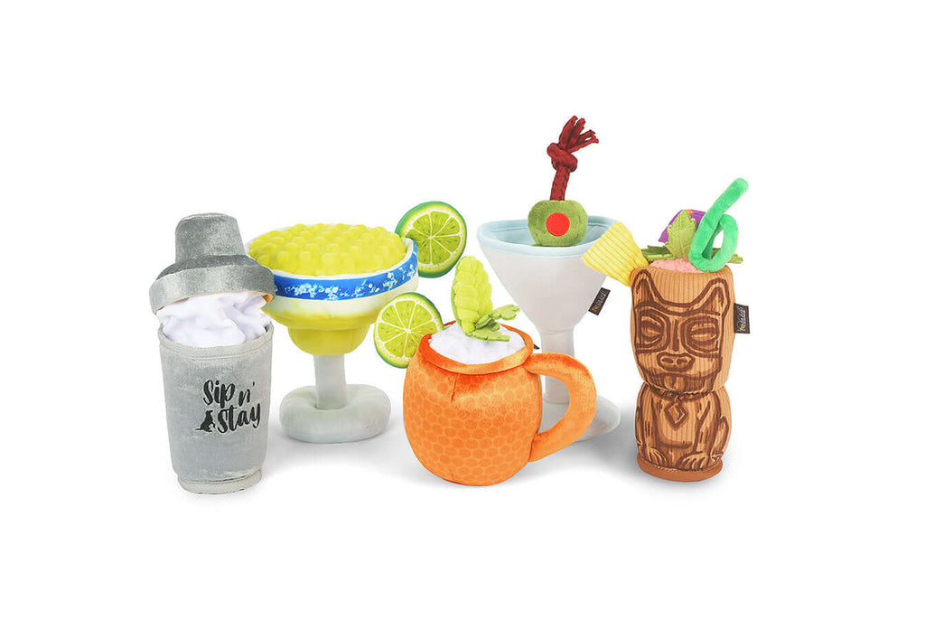 "P.L.A.Y. Barktender Toy Set featuring plush cocktail-inspired toys for dogs with margarita, shaker, and tropical designs."