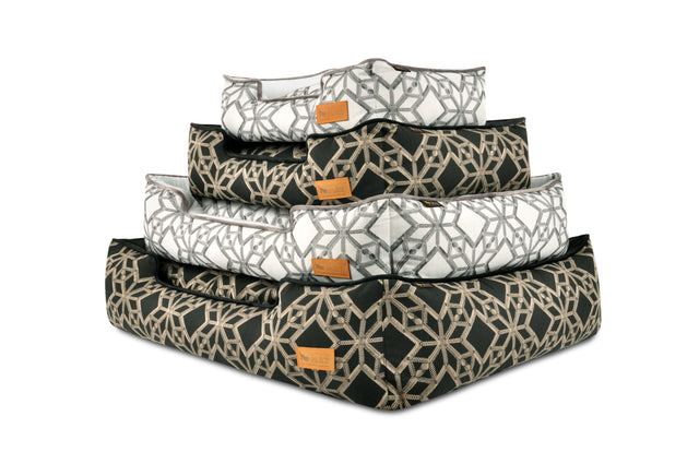P.L.A.Y. Solstice Lounge Beds in geometric patterns stacked in various sizes and colors for royal comfort of your furry friend