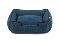 P.L.A.Y. Manhattan Lounge Bed in blue with raised sides for pet comfort, bolster style dog bed.