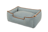 P.L.A.Y. Manhattan Lounge Bed, bolster style dog bed with raised sides for headrest in sleek striped design. Perfect for pet relaxation.