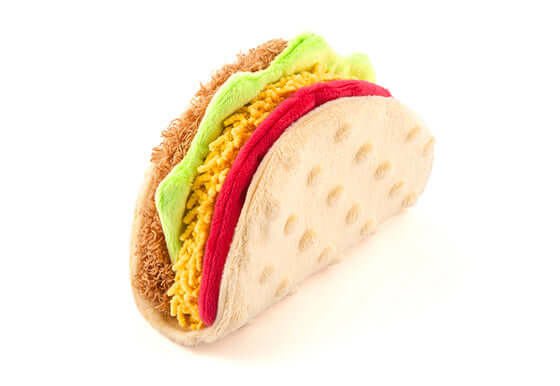 Playful taco-shaped dog toy from P.L.A.Y. International Classic Toy Set, featuring vibrant colors and soft materials for fun playtime.