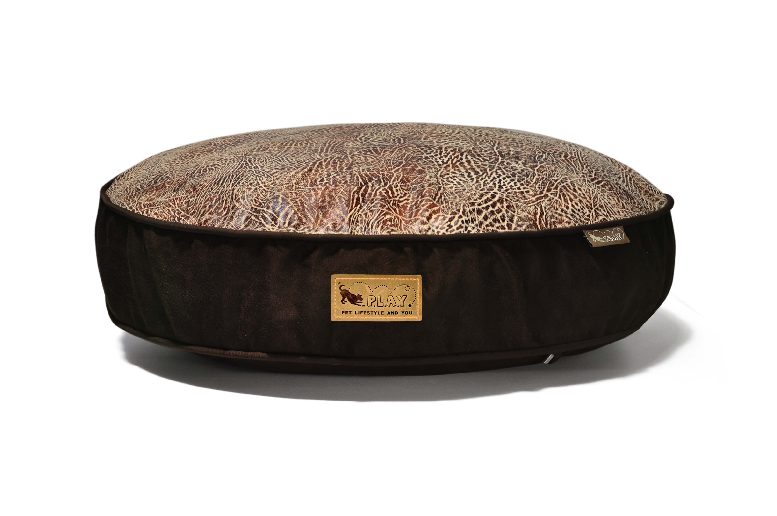 P.L.A.Y. Savannah Round Bed with bold animal print, perfect for pets to unwind after a day of activities, combining wild and comfy elements.