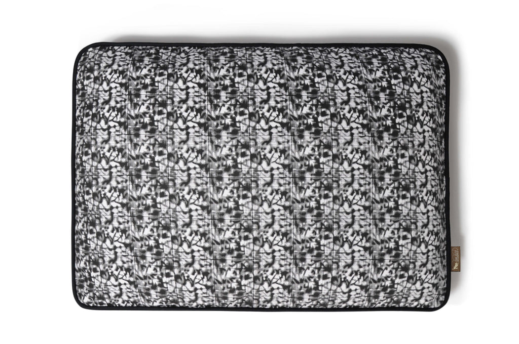 P.L.A.Y. Frolic Rectangle Bed with playful fabric design in black and white for energetic dogs.