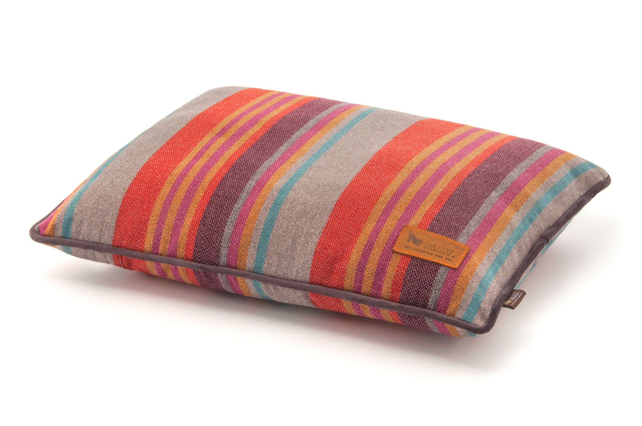 P.L.A.Y. Horizon Pillow Bed with vibrant earthy hues and durable woven fabric for pets in cabin or beachside retreats.