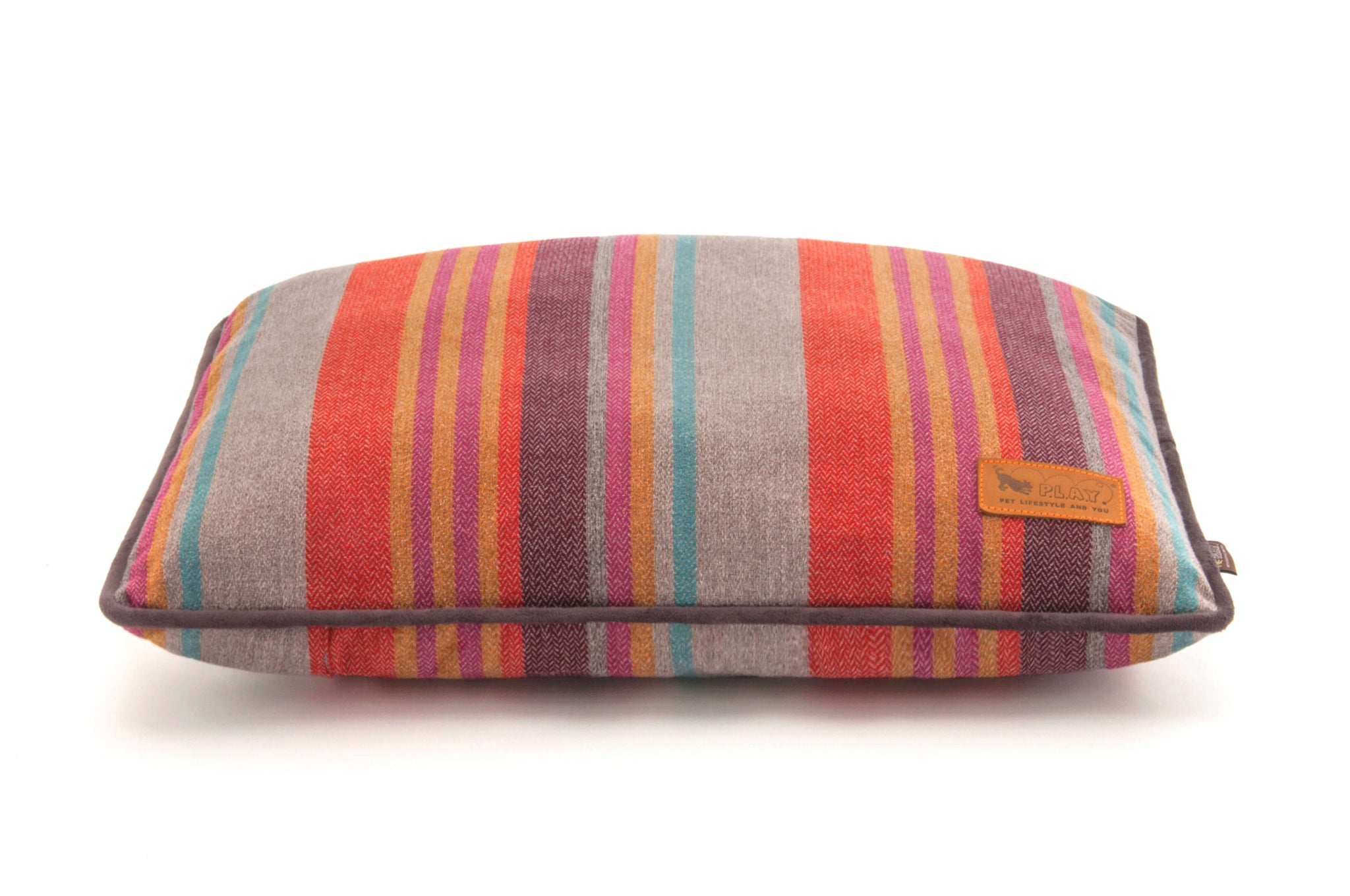 P.L.A.Y. Horizon Pillow Bed with colorful striped woven fabric, ideal for cozy cabin or beachside retreat, providing comfort for any pup's snooze style