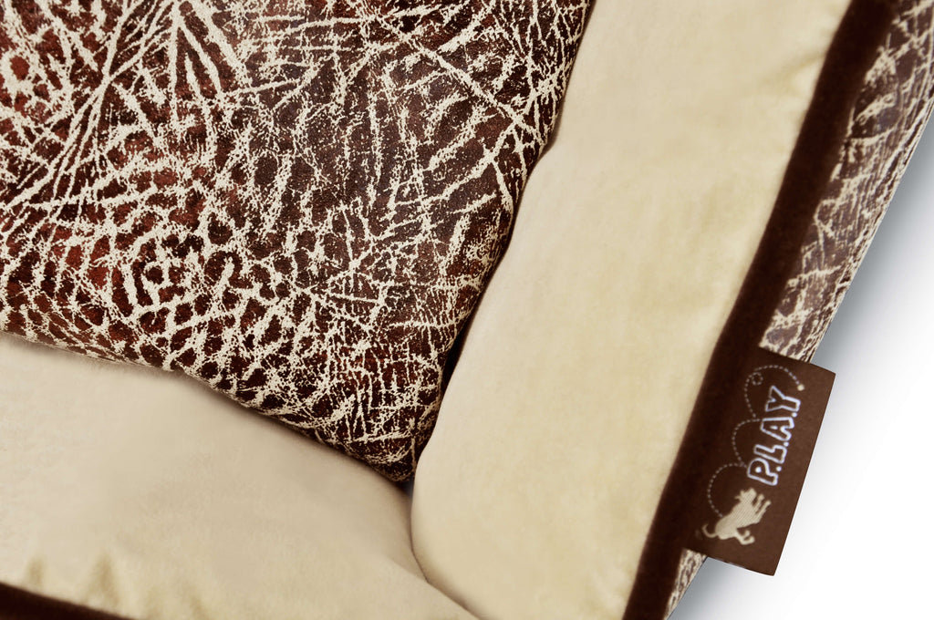 Close-up of P.L.A.Y. Savannah Lounge Bed with wild grassy plains fabric pattern and soft microsuede material.