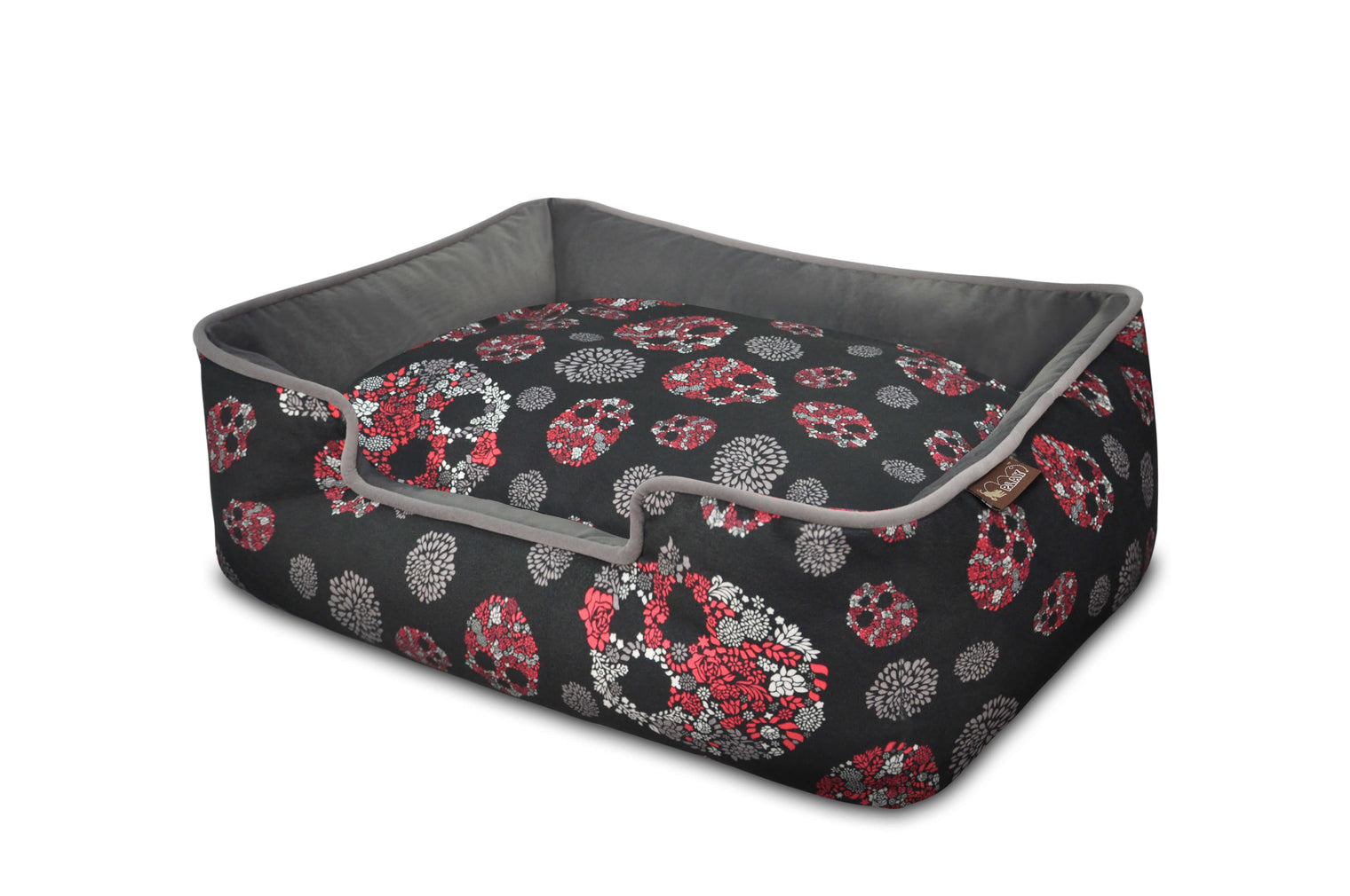 P.L.A.Y. Skulls & Roses Lounge Bed with skull and flower design, offering comfort with raised sides and reversible cushion.