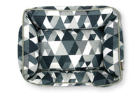 Mosaic Lounge Bed with colorful geometric pattern in Tuxedo color, crafted from 100% natural cotton, providing stylish comfort for pets