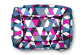 P.L.A.Y. Mosaic Lounge Bed in colorful geometric pattern, featuring bold triangles in blue, pink, and white.