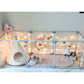 Puppy sitting inside 27" medium Lucidium pet pen in silver