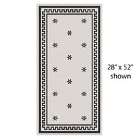 Rome vinyl mat with black and white design, custom made to order, shown in size 28"x52". Perfect for modern pet spaces.