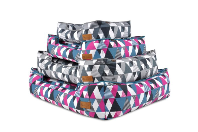 P.L.A.Y. Mosaic Lounge Beds with colorful geometric pattern in Tuxedo and Soda Pop colors stacked together.