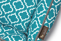 Teal P.L.A.Y. Moroccan Lounge Bed with intricate white patterns and 100% natural cotton fabric for dogs.