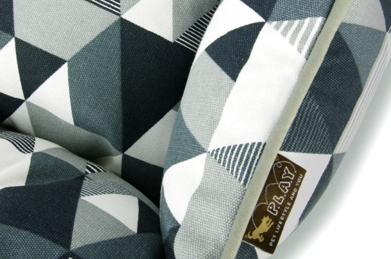 Mosaic Lounge Bed with colorful geometric pattern by P.L.A.Y. featuring a bold tuxedo color scheme in 100% natural cotton.
